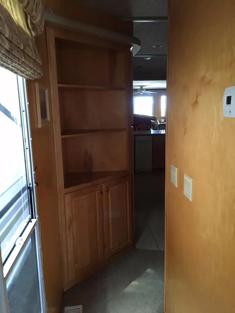Slide: The Image of Interior of 2002 Sharpe Just Because Week 30 houseboat with wooden cabinets. - 9