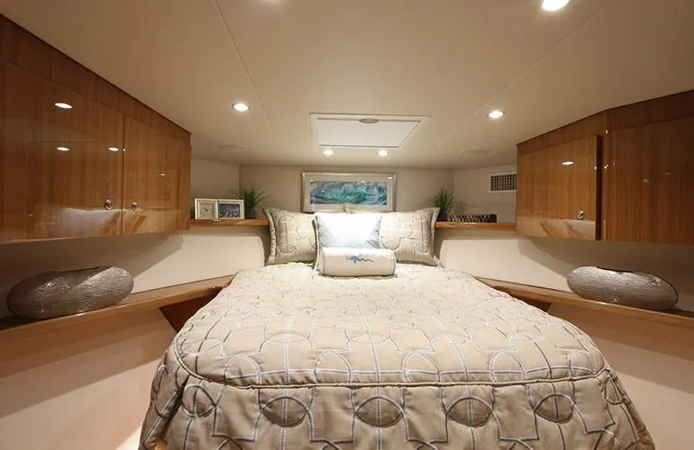 Slide: The Image of Luxurious bedroom interior of 2025 Viking 44 Open Express yacht with elegant bedding. - 10