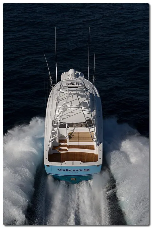 Slide: The Image of 2025 Viking 44 Open Express yacht cruising on open water. - 2
