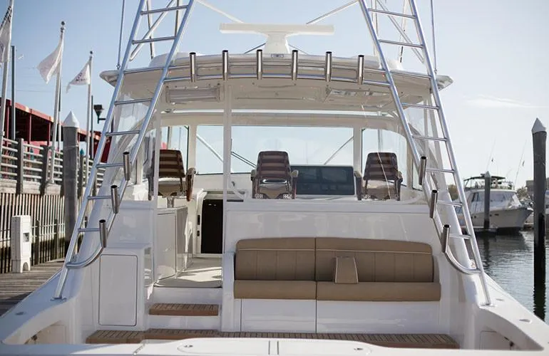 Slide: The Image of 2025 Viking 44 Open Express yacht at dock, rear view. - 3