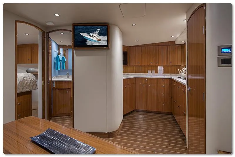 Slide: The Image of Luxurious interior of 2025 Viking 44 Open Express yacht with wooden cabinetry and modern amenities. - 7