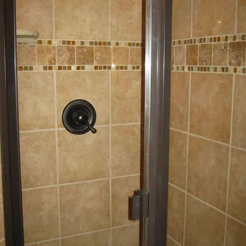 Slide: The Image of Tile shower with glass door and black handle, Bravada Dream Weaver Trip 6, 2011 model. - 8