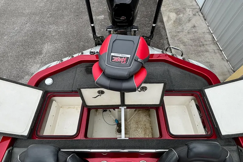 Slide: The Image of 2016 Ranger Z520 boat interior with open storage compartments and seating. - 12