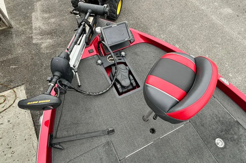 Slide: The Image of 2016 Ranger Z520 boat deck with red and black seat, trolling motor, and fishfinder. - 3