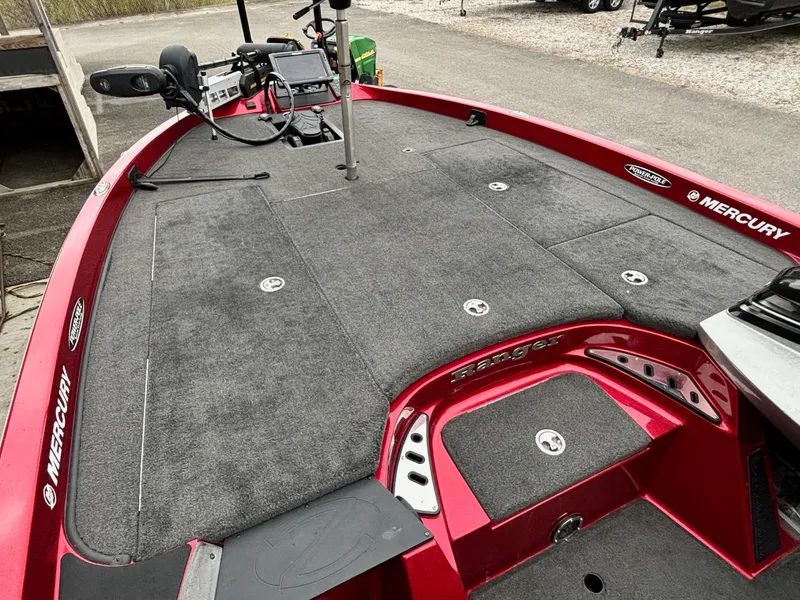 Slide: The Image of 2016 Ranger Z520 boat deck with Mercury branding, featuring fishing equipment and controls. - 5