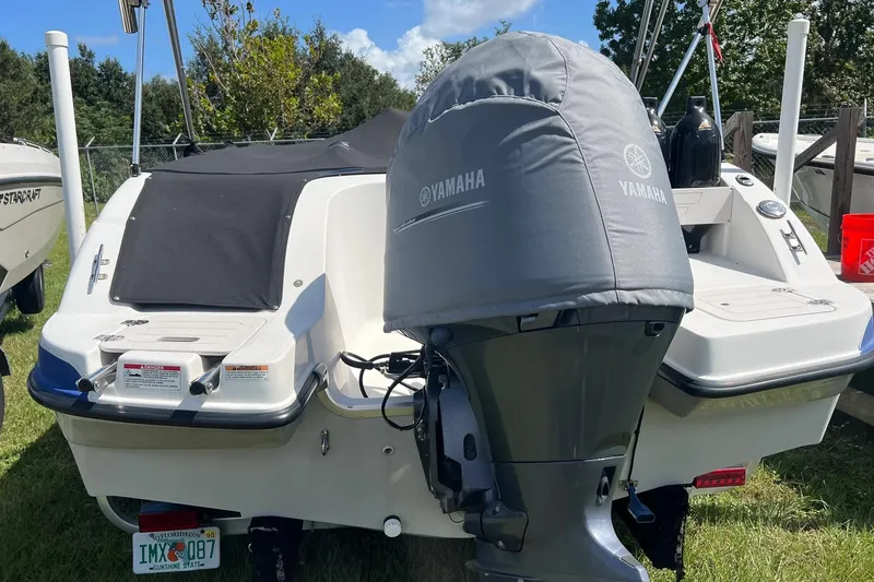 Slide: The Image of 2022 Starcraft Limited 2000 OB Fish boat with Yamaha engine, parked outdoors. - 5