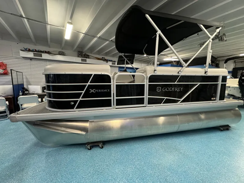 The Image of 2024 Sweetwater 1680 C pontoon boat in showroom. - 0