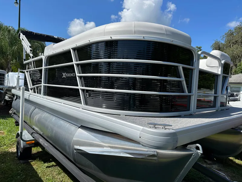Slide: The Image of 2024 Sweetwater 1680 C pontoon boat with sleek design and modern features. - 3