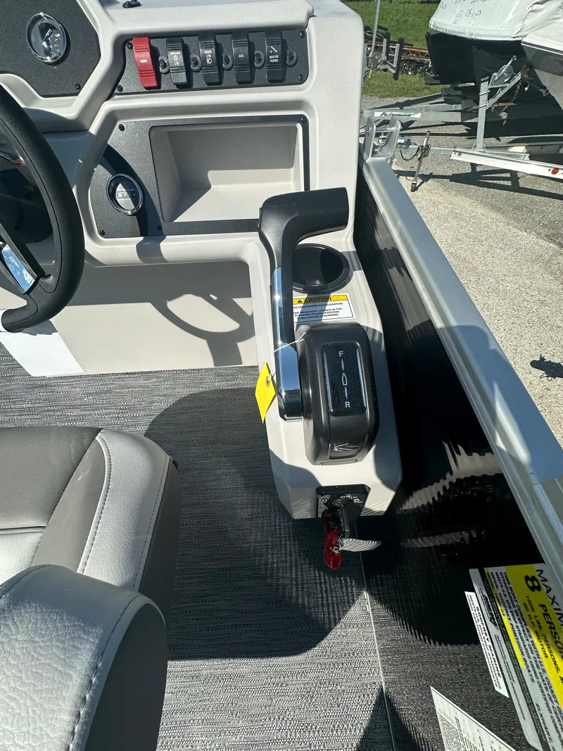 Slide: The Image of 2024 Sweetwater 1680 C boat control panel and throttle lever. - 8
