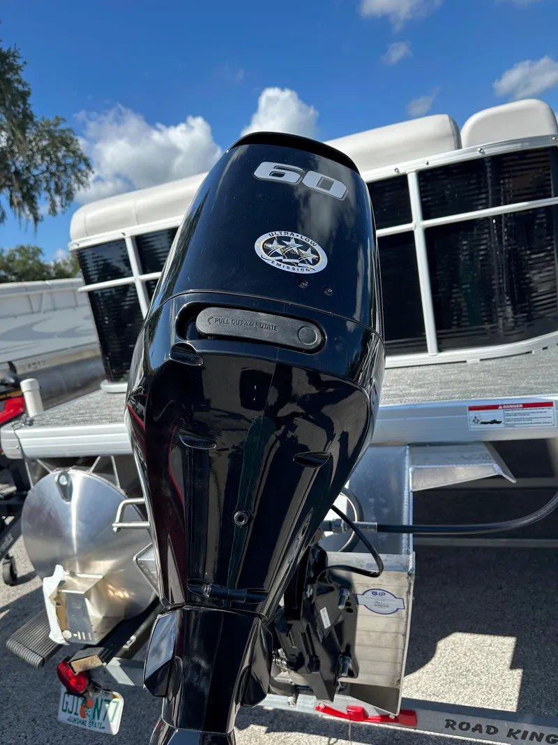 Slide: The Image of 2024 Sweetwater 1680 C boat with a 60 HP outboard motor. - 9