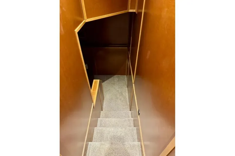 Slide: The Image of Carpeted stairs with wooden walls inside Bravada Helios Trip #7, 2012 model. - 13