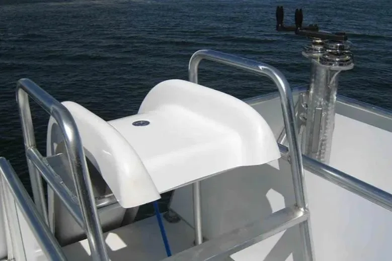Slide: The Image of White boat seat with metal railing on Bravada Helios Trip #7, 2012, overlooking water. - 21