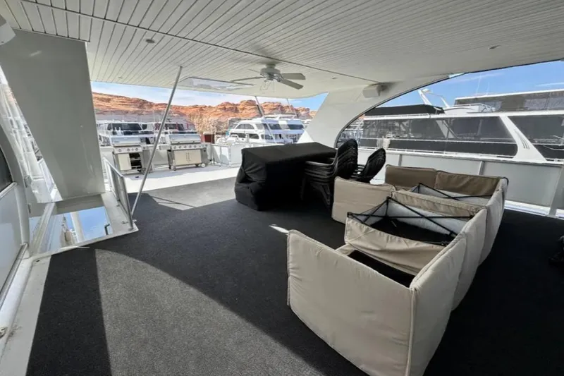 Slide: The Image of Spacious deck of 2012 Bravada Helios Trip #7, featuring outdoor seating and grills. - 27