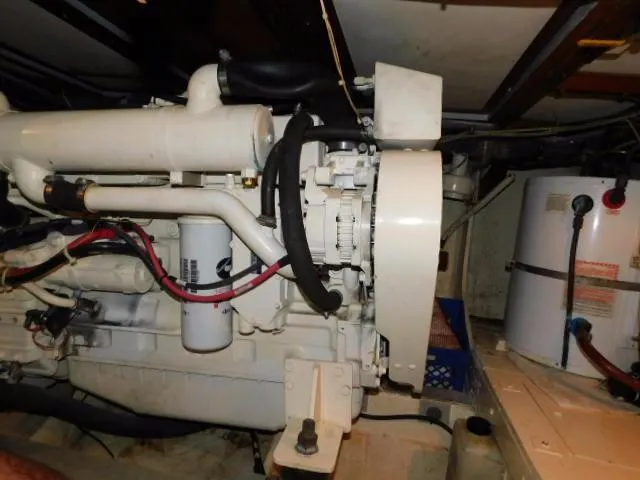 Slide: The Image of Engine room of a 1976 Bertram 42 Convertible boat, showcasing mechanical components. - 29