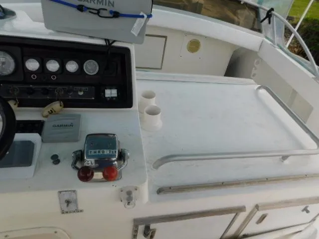 Slide: The Image of Control panel of a 1976 Bertram 42 Convertible boat with gauges and navigation equipment. - 34