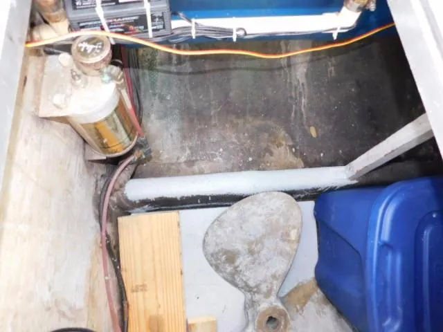 Slide: The Image of 1976 Bertram 42 Convertible engine compartment with propeller and fuel filter. - 8