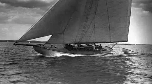 The Image of Vintage 1903 Herreshoff Bar Harbor 31 sailboat gliding on open water. - 0