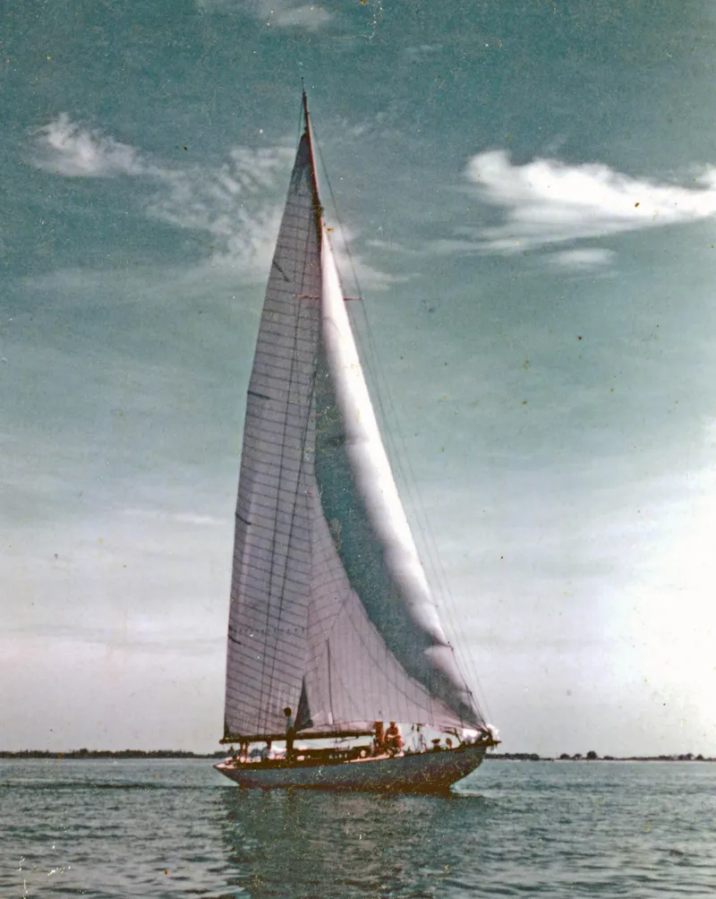 Slide: The Image of Sailing yacht Herreshoff Bar Harbor 31, 1903, on calm waters under a clear sky. - 8