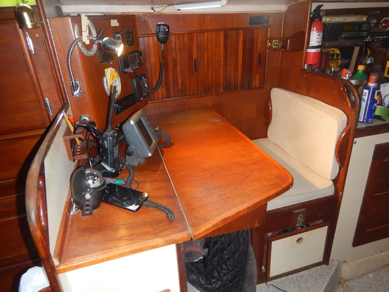 Slide: The Image of Navigation station on a 1983 Whitby 42 sailboat with communication equipment. - 18