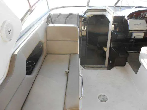 Slide: The Image of 2013 Regal 35 Express Cruiser interior seating and helm area. - 15