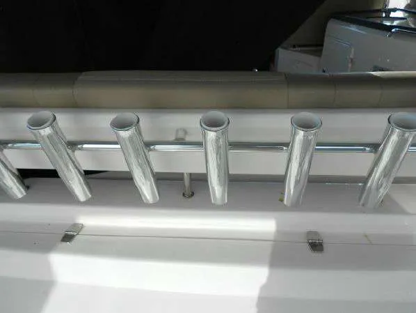 Slide: The Image of Rod holders on a 2013 Regal 35 Express Cruiser boat. - 19