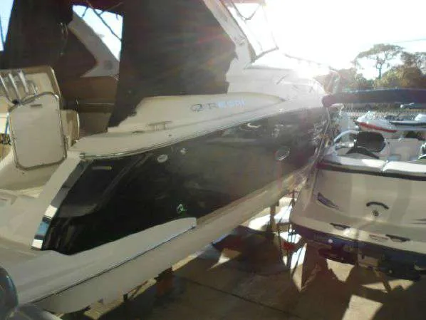 Slide: The Image of 2013 Regal 35 Express Cruiser in a marina, side view. - 22