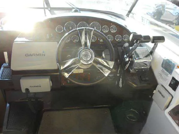 Slide: The Image of 2013 Regal 35 Express Cruiser helm with Garmin navigation system. - 24