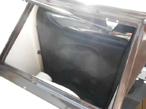 Slide: The Image of Open hatch on a 2013 Regal 35 Express Cruiser boat. - 28