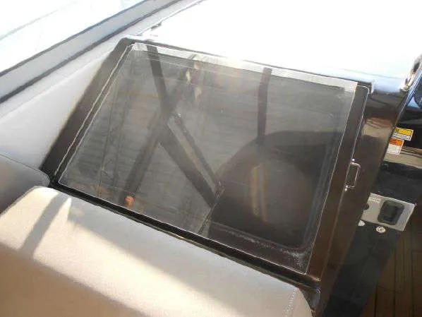 Slide: The Image of 2013 Regal 35 Express Cruiser dashboard with sunlit navigation screen. - 29