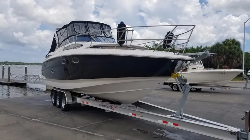 Slide: The Image of 2013 Regal 35 Express Cruiser on trailer at marina. - 36