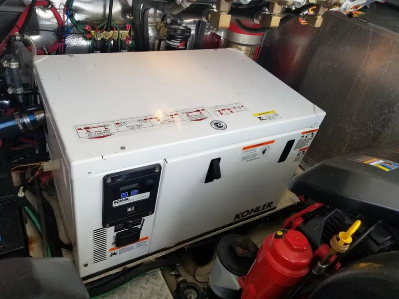 Slide: The Image of Kohler generator in the engine room of a 2013 Regal 35 Express Cruiser. - 43