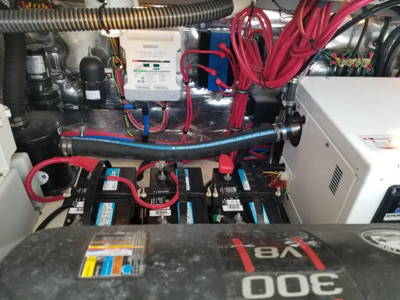 Slide: The Image of Engine compartment of a 2013 Regal 35 Express Cruiser with batteries and wiring. - 44