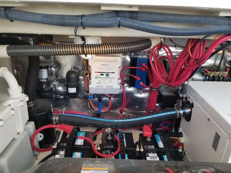 Slide: The Image of Engine compartment of a 2013 Regal 35 Express Cruiser with batteries and wiring. - 45