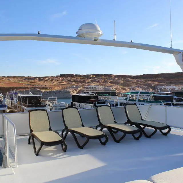 Slide: The Image of Deck of 2013 Bravada Houseboat Apollo Trip #7 with lounge chairs and scenic view. - 11