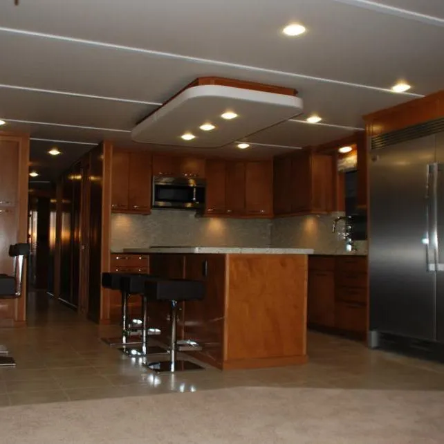 Slide: The Image of Modern kitchen interior of 2013 Bravada Houseboat Apollo Trip #7 with island and bar stools. - 15