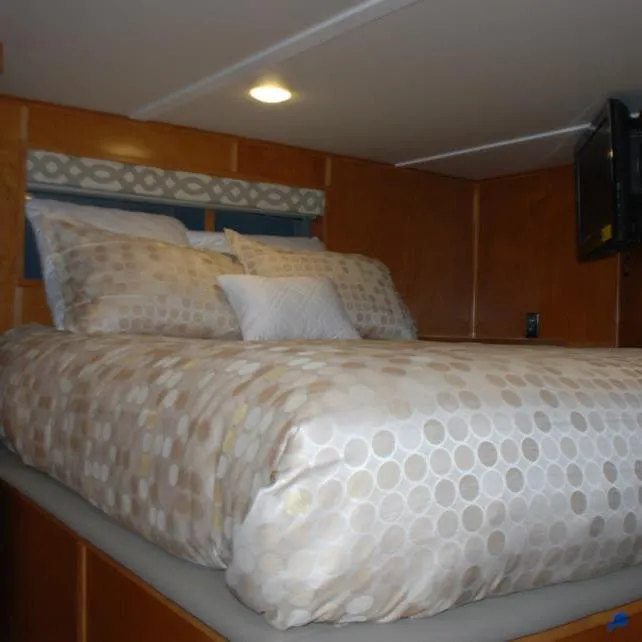 Slide: The Image of Cozy bedroom in 2013 Bravada Houseboat Apollo Trip #7 with patterned bedding. - 21