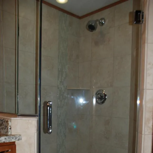 Slide: The Image of Modern shower in 2013 Bravada Houseboat Apollo Trip #7 with glass door and tiled walls. - 23