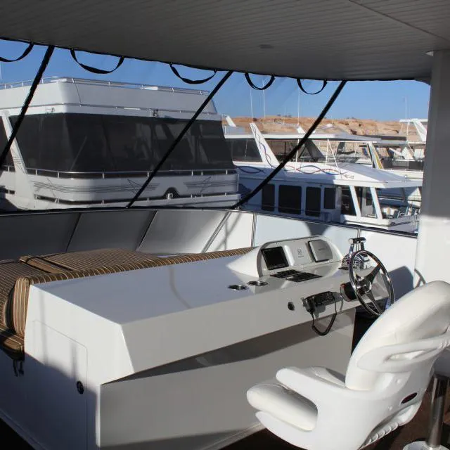 Slide: The Image of Captain's helm of 2013 Bravada Houseboat Apollo Trip #7 with marina view. - 6