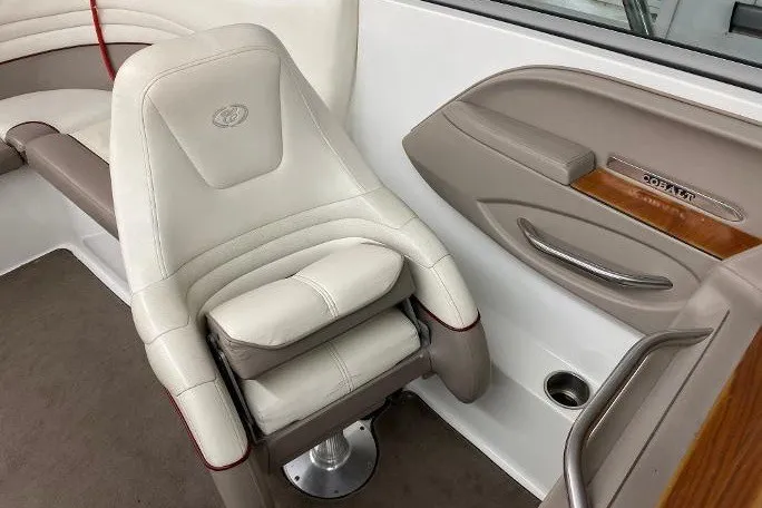 Slide: The Image of Luxury seating in a 2000 Cobalt 246 boat, featuring beige and white upholstery. - 9