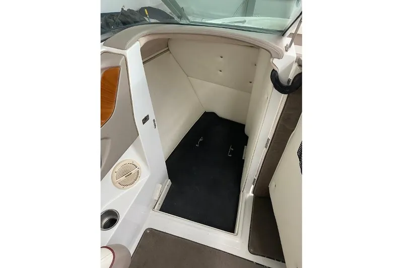 Slide: The Image of Interior cabin of a 2000 Cobalt 246 boat, featuring a compact, clean design. - 8
