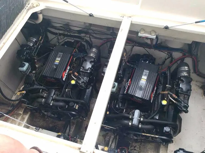 Slide: The Image of Twin engines in a 1997 Maxum 3200 SCR boat engine compartment. - 19