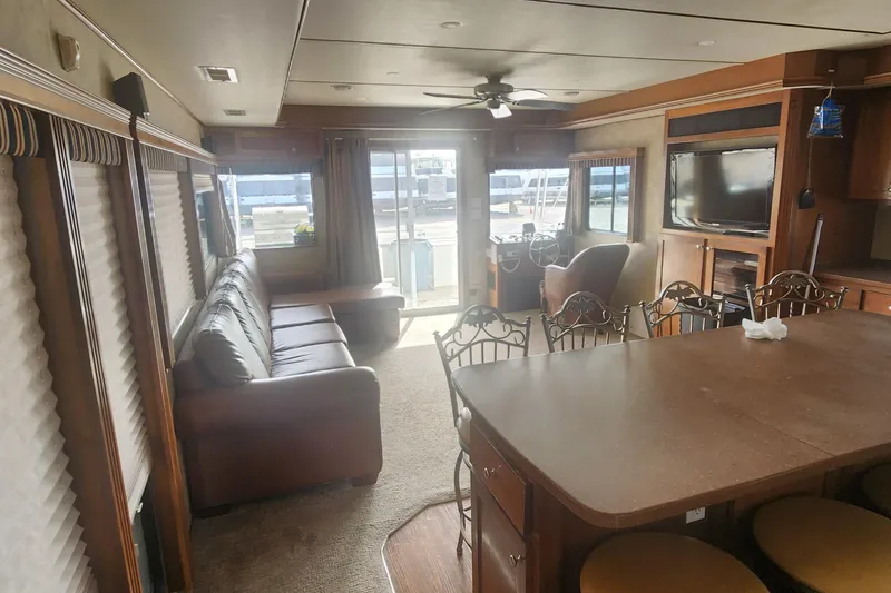 Slide: The Image of Interior of 2010 Destination Yachts Starchaser Share #10, featuring cozy seating and modern amenities. - 12