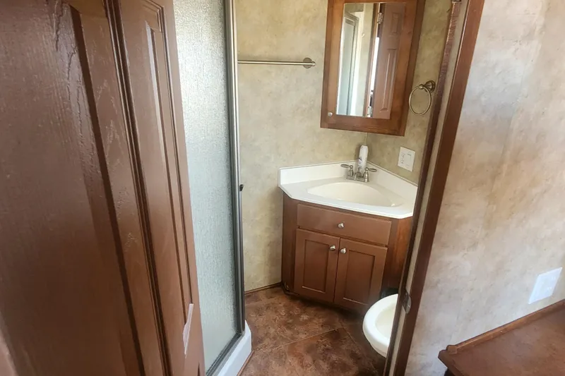 Slide: The Image of Bathroom interior of 2010 Destination Yachts Starchaser Share #10 with shower and vanity. - 6