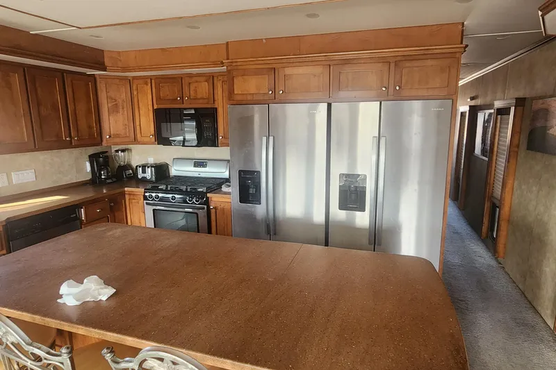 Slide: The Image of Engine compartment of 2010 Destination Yachts Starchaser Share #10, featuring red machinery components. - 11