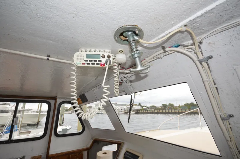 Slide: The Image of Interior of a 1978 JC 31 boat showing radio equipment and wiring. - 15
