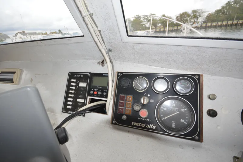 Slide: The Image of Control panel of a 1978 JC 31 boat with gauges and switches. - 16