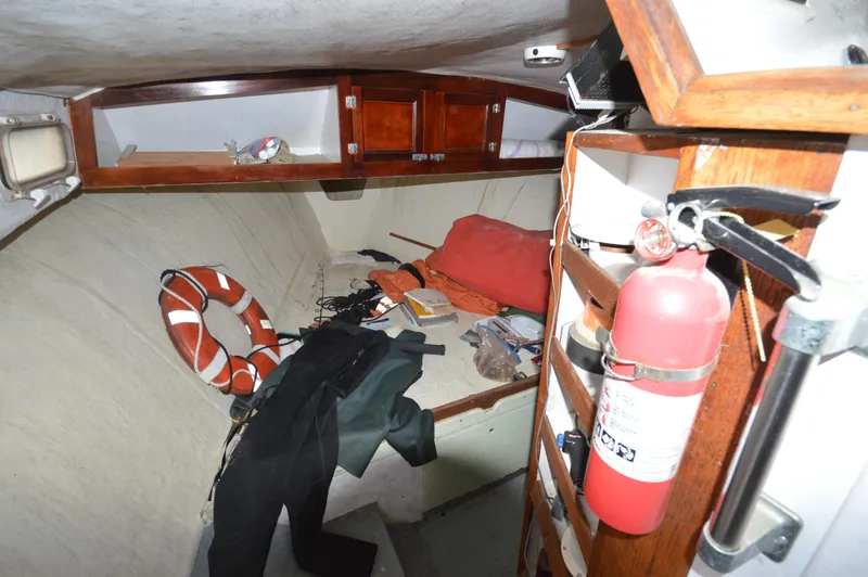 Slide: The Image of Interior of a 1978 JC 31 boat with life preserver and fire extinguisher. - 17