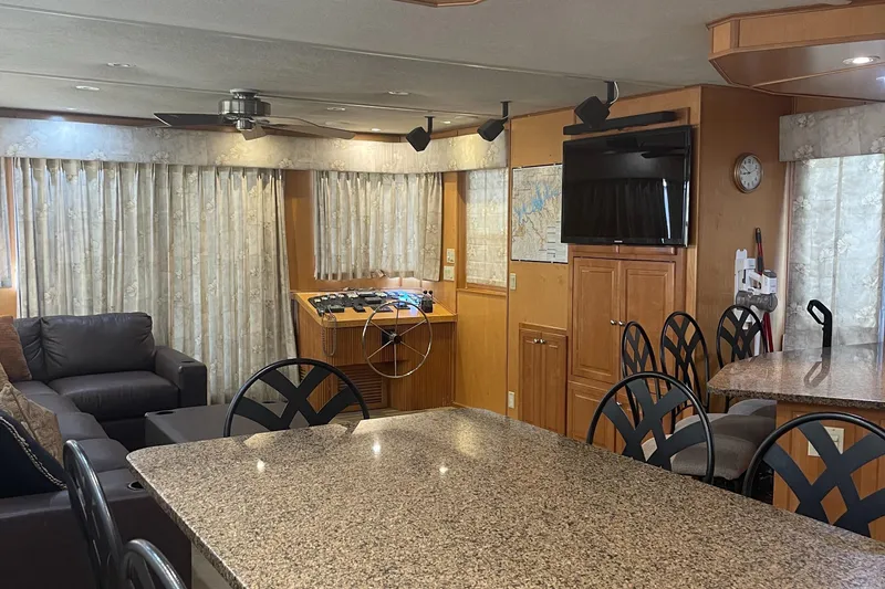 Slide: The Image of Interior of 2003 Sharpe Wailea Trip houseboat with granite countertops and cozy seating area. - 11