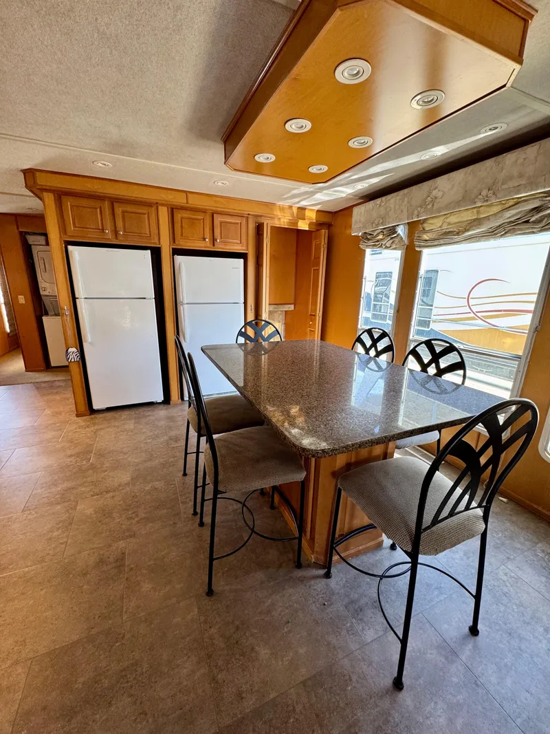 Slide: The Image of Luxurious 2003 Sharpe Wailea Trip interior with modern kitchen and dining area. - 14