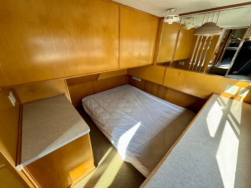 Slide: The Image of Compact wooden cabin interior with a bed, featuring Sharpe Wailea Trip design, 2003 model. - 17